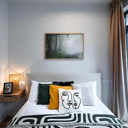 Apartament Design With Double Bed And Quiet Yard View